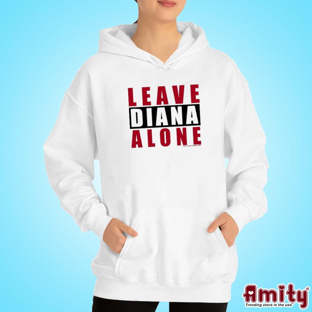 A woman wearing a leave Diana alone t-s hoodie